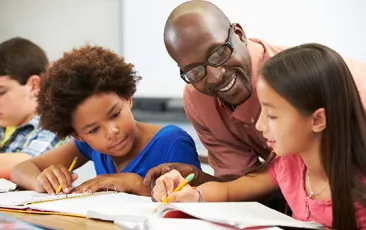 Image of teacher with young students 