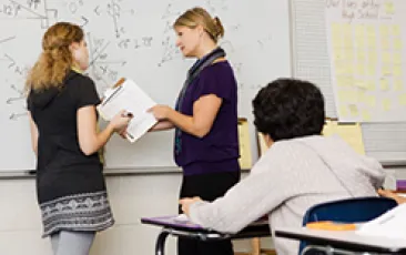 Teachers at whiteboard