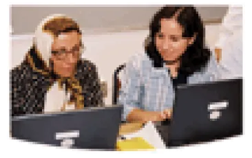 teacher working with an adult learner woman 