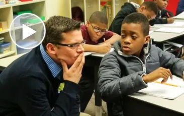 Math teacher working with student