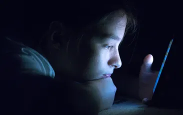 Girl looking lonely in the dark