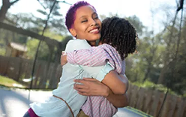 Woman and child hugging