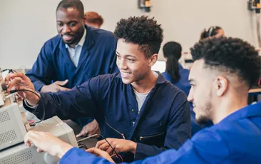 Apprentices working on computers
