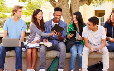 Diverse group of teenage students outside