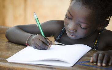 African girl studying in classroom