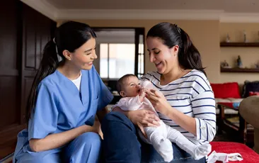 Home visit with mother and baby