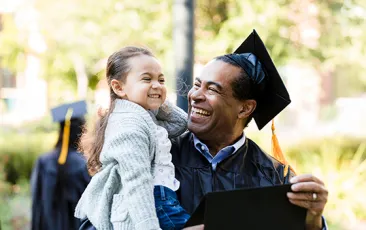 Little girl makes graduating grandfather laugh