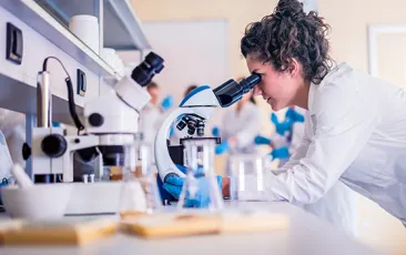 Female scientist at microscope