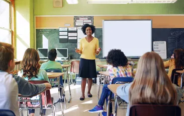 Teacher at the front of a classroom
