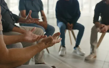 Man in a group therapy meeting