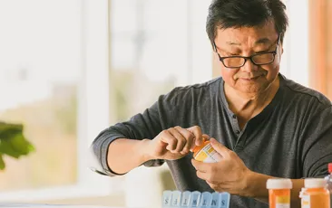 Older man with prescription bottle