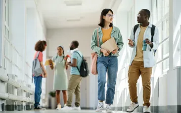 High school students talking in hallway
