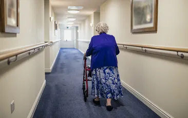 Woman with walker in nursing home