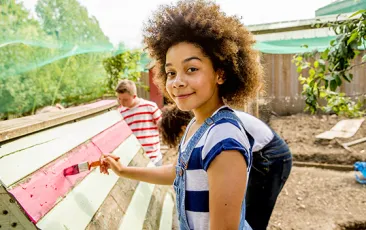 Child painting outside