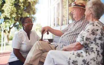 Nurse with patients in nursing home