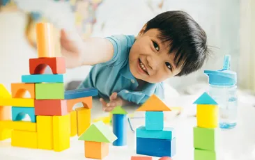 Preschool boy playing with blocks