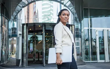 Young business woman outside office building