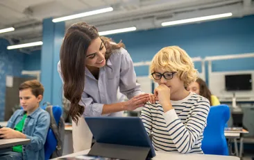 Smiling teacher with middle school student