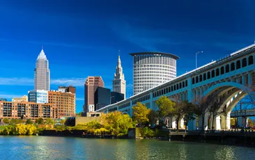 Downtown Cleveland with River, Bridge, Trees, and Deep Blue Sky 