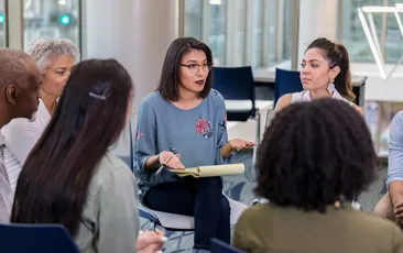 Colleagues meeting in a circle