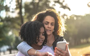 Mom and daughter on smartphone