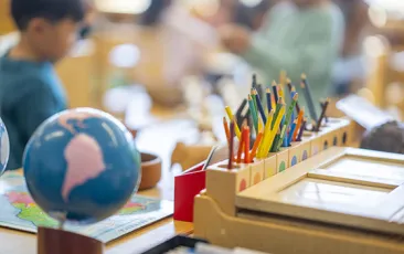 Social studies classroom showing a globe and colored pencils