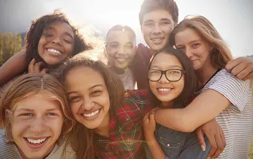 Group of happy teens outside