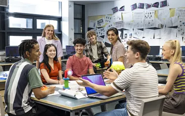 Happy high school students in a classroom