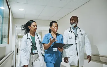 health care workers walking and talking