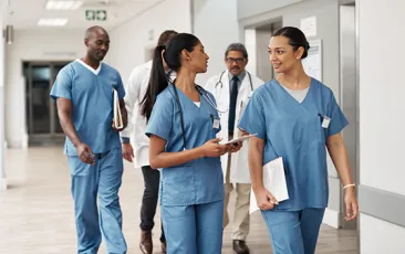 health care workers walking in hospital