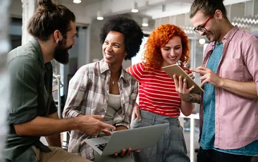 Young adults with laptop and iPad