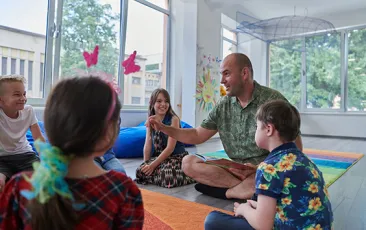 Preschool teacher with young students