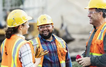 Construction workers laughing together