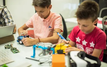 Kids working together in an afterschool tech program