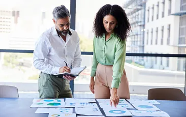 Coworkers reviewing data together