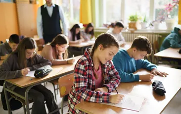 Students taking an exam in classroom