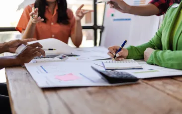 Colleagues working together at a desk