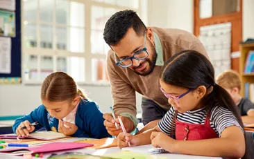 Male teacher with young students