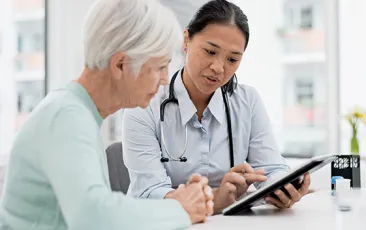 Doctor with older patient