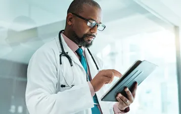Doctor consulting an iPad