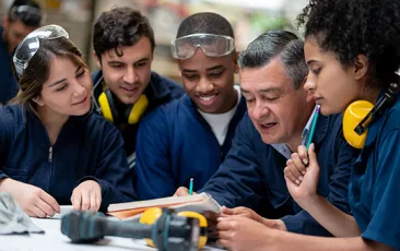 Factory workers with supervisor