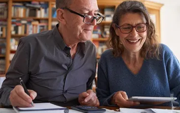 Older couple reading through documents
