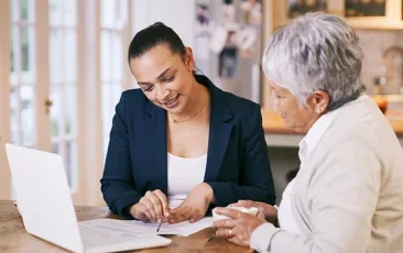 Older woman working with home health care professional