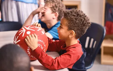 Boy with Special Olympics soccer ball