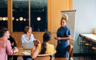 Teachers meeting in conference room