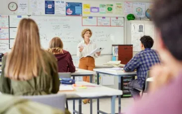 Teacher discussing assignment in class