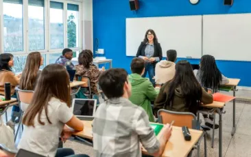 Teacher talking to students in class