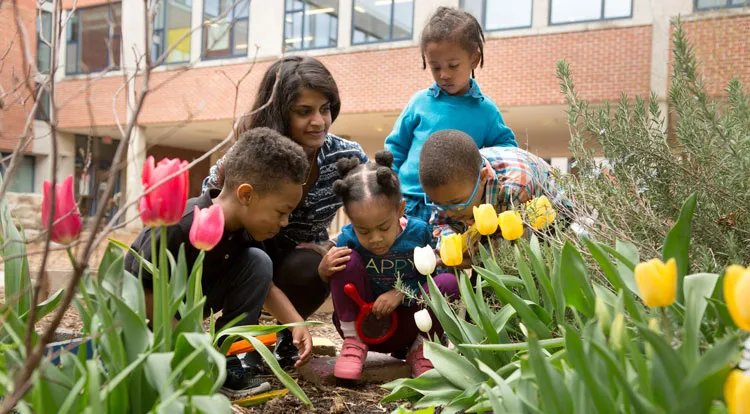 Children and teacher in garden