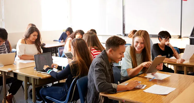 Students in classroom with iPad