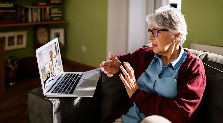 Older patient having a telehealth call with physician